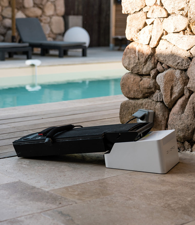 Awake Flex Battery Charger US charging Awake Flex Battery by the pool